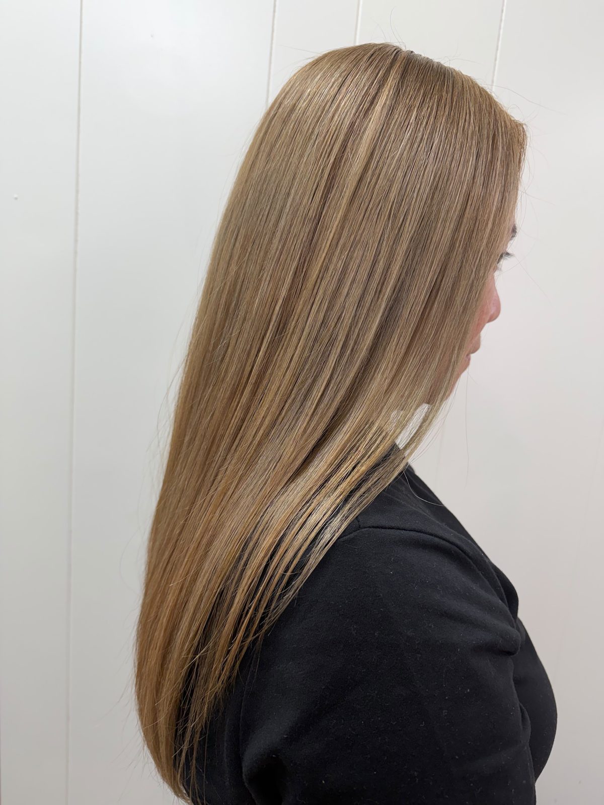 Long balayage blonde hair blowout styled at Martha's Unisex Beauty Studio