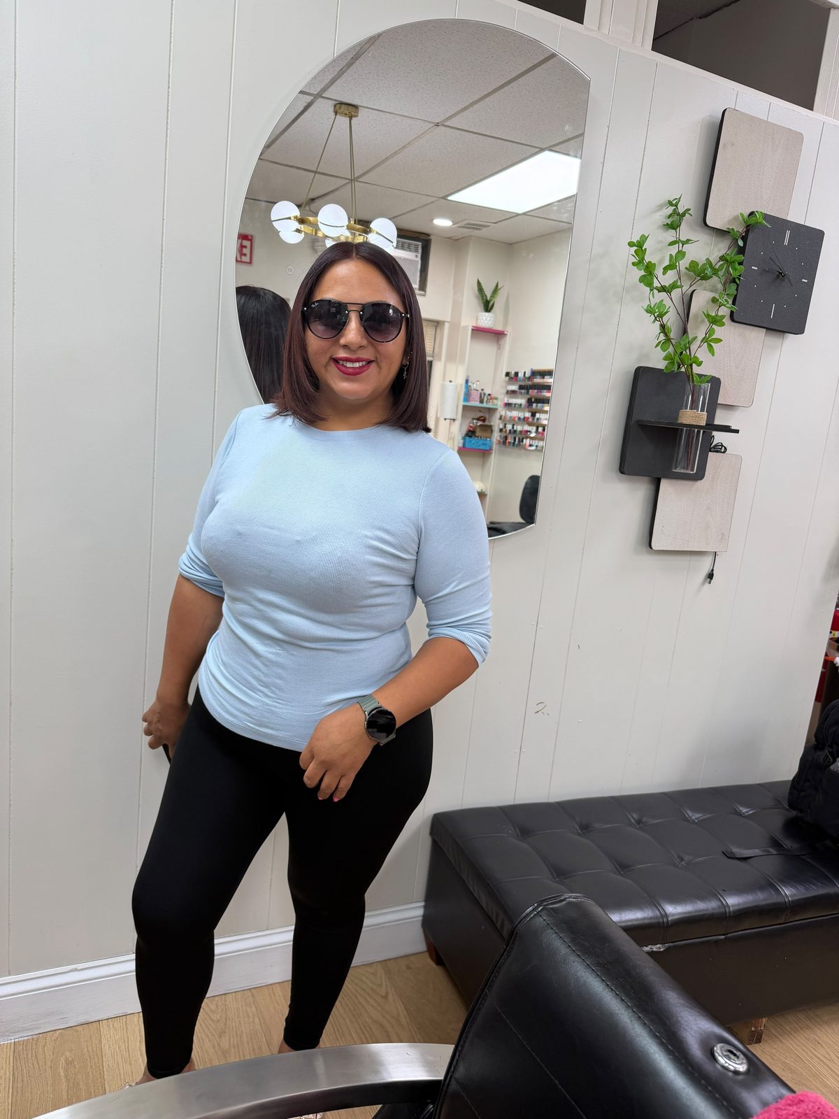 Client inside the salon interior at Martha's Unisex Beauty Studio LLC