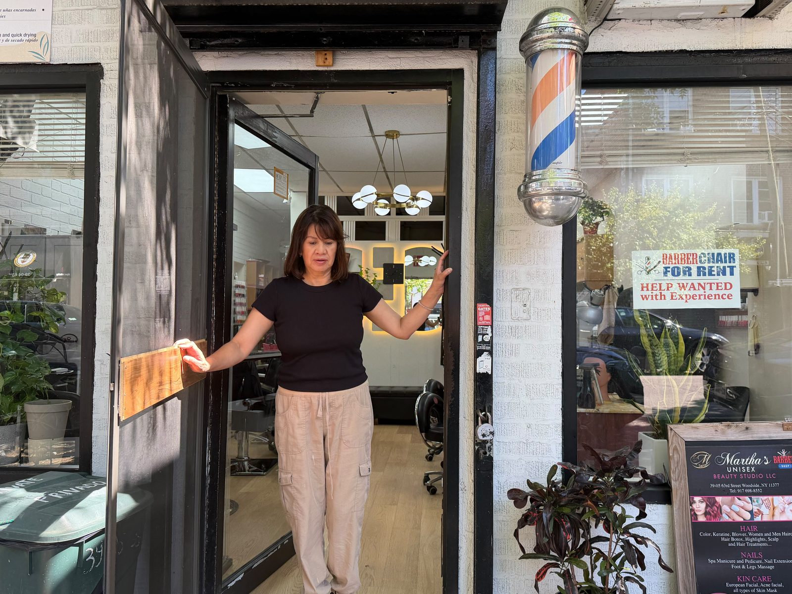 Martha Cabrera welcoming clients at the studio entrance, 39-05 63rd Street, Woodside NY